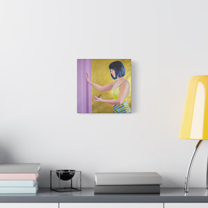 A stretched canvas wall art featuring a woman with black hair in a yellow and blue dress, reaching out to a bird on a purple background.