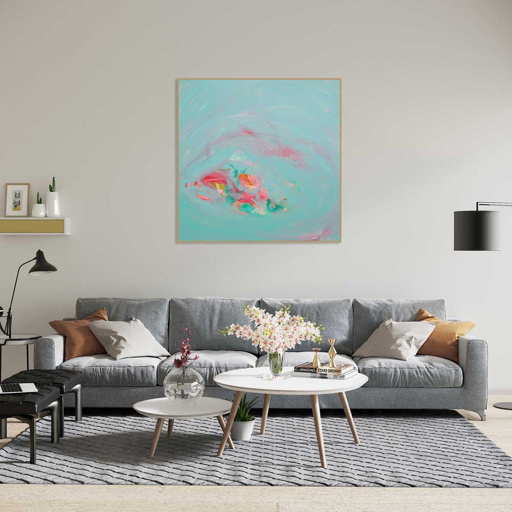 Living room with a gray sofa, coffee table, and abstract painting on the wall.