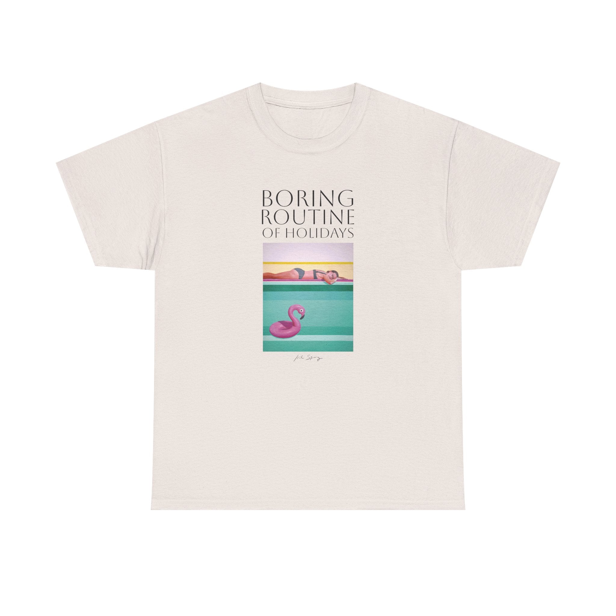 A person wearing a pink unisex crew neck t-shirt with a graphic design and text, standing against a plain background.