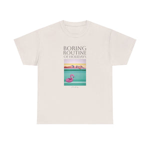 A person wearing a pink unisex crew neck t-shirt with a graphic design and text, standing against a plain background.