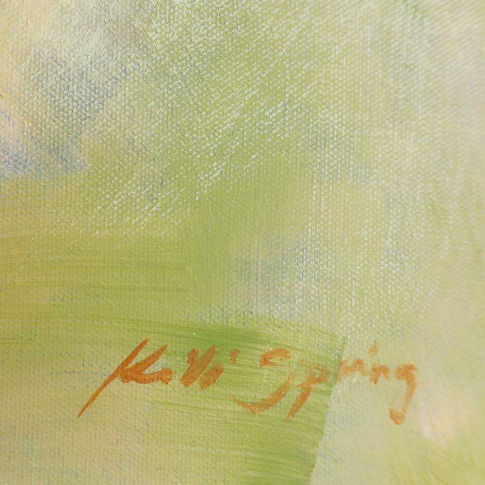 Close-up of a signature on a textured green background