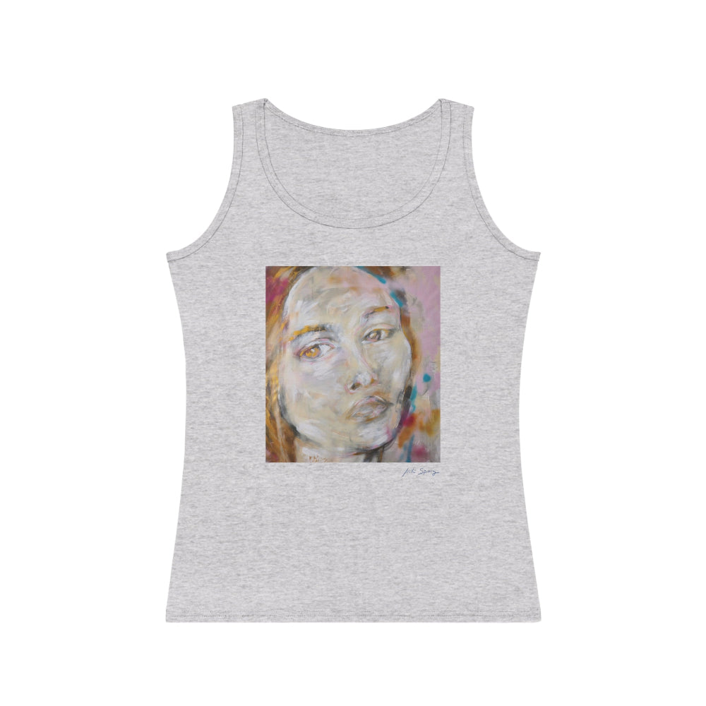 A woman wearing a gray tank top with an abstract portrait design in the center.