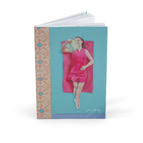 Notebook with a design of a woman in a pink dress on a blue background