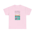 Load image into Gallery viewer, A person wearing a pink unisex crew neck t-shirt with a graphic design and text, standing against a plain background.
