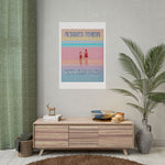 Load image into Gallery viewer, Framed poster with 'Summer Begins' text on a wall above a wooden cabinet.

