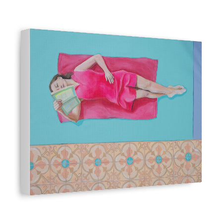 Woman in a pink dress lying on a blue surface with a book, framed with decorative border.