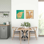 Load image into Gallery viewer, Dining area with wooden table and chairs, featuring two cow paintings on the wall.

