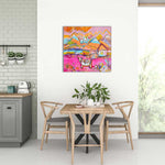 Load image into Gallery viewer, Dining room with a colorful abstract painting on the wall above a table and chairs.

