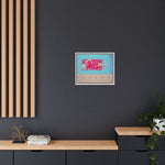 Load image into Gallery viewer, Framed artwork of a woman in a pink dress on a dark gray wall with wooden shelves below.
