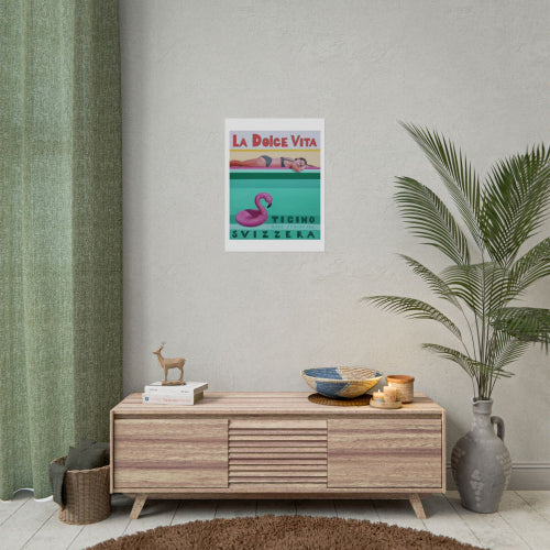 Poster on a wall above a wooden cabinet with decorative items in a room.