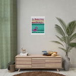 Load image into Gallery viewer, Poster on a wall above a wooden cabinet with decorative items in a room.
