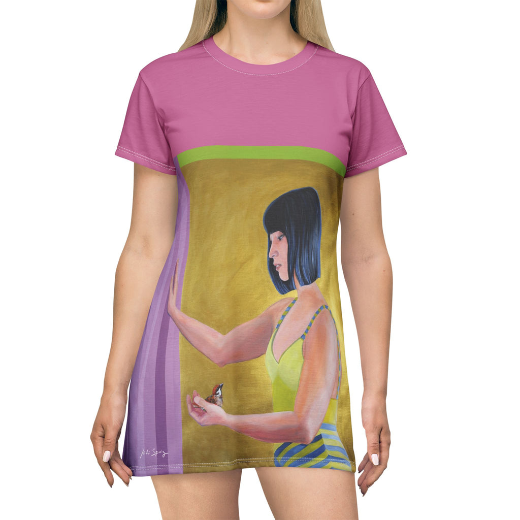 Front view of pink pop‑art T‑shirt dress by Kiki Spring showcasing a clean cut and relaxed fit. The painting portrait of the Asian woman holding a small bird. 