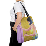 Load image into Gallery viewer, A tote bag featuring a vibrant acrylic painting of an asian woman with black hair, yellow top, and a purple background, with a small bird in her hand.
