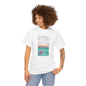 A person wearing a pink unisex crew neck t-shirt with a graphic design and text, standing against a plain background.