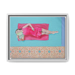 Load image into Gallery viewer, Framed artwork of a woman in a pink dress lying on a blue background with a decorative border.
